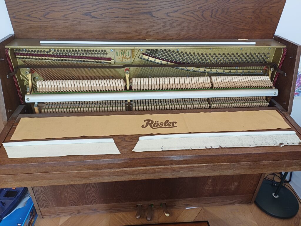 The old and new felt displayed on the piano